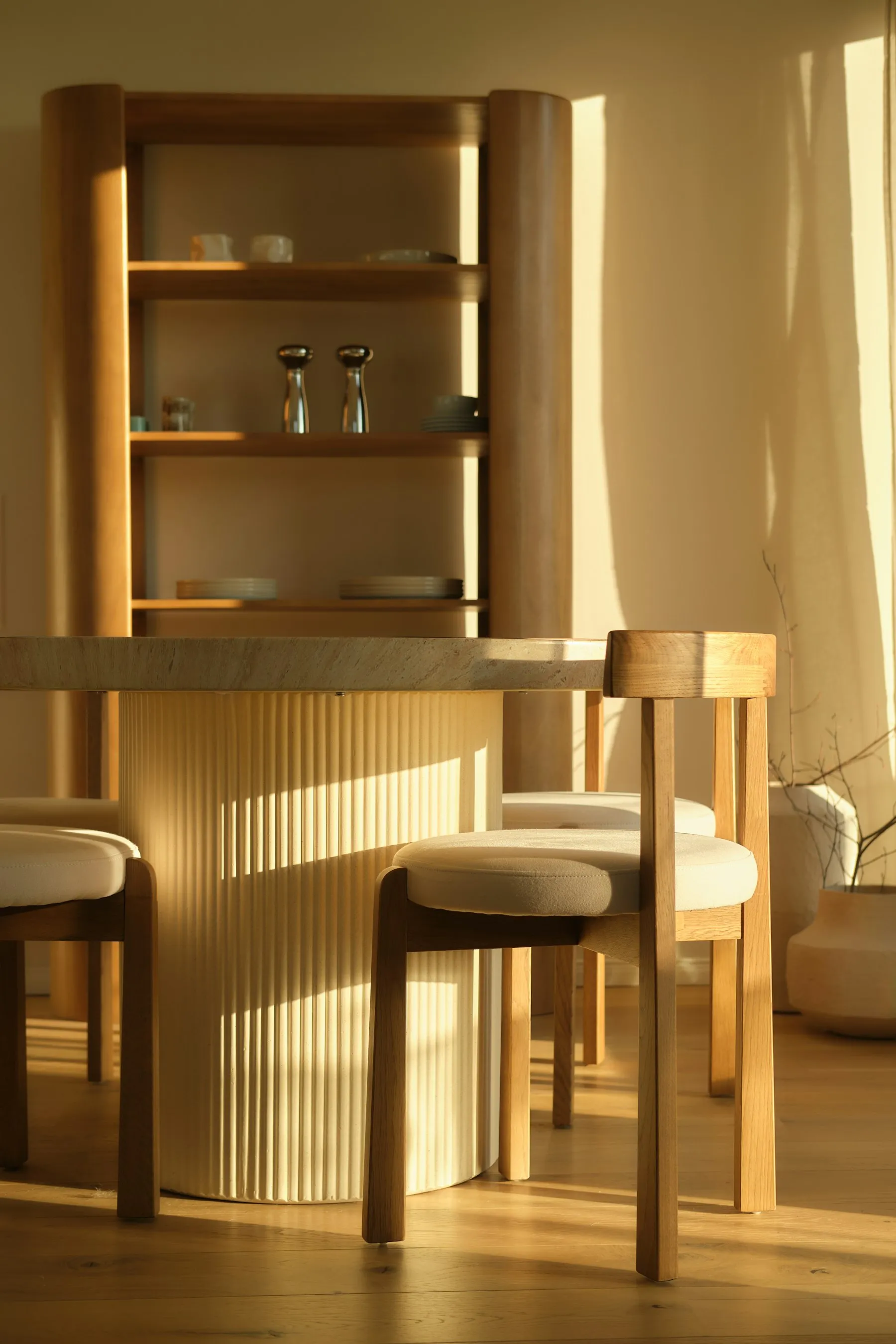 A dining room with an oak table