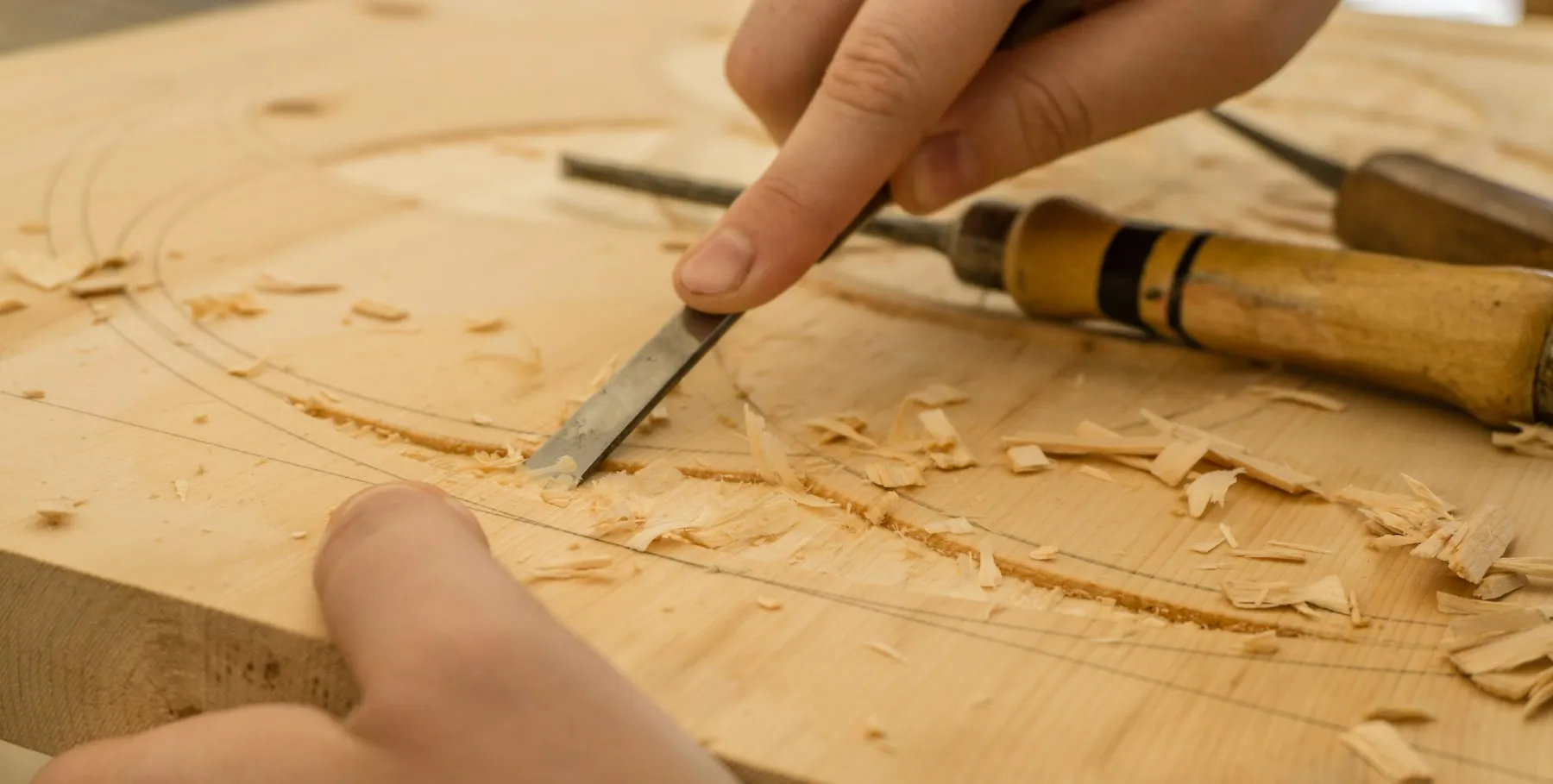 An engraved name on an oak top
